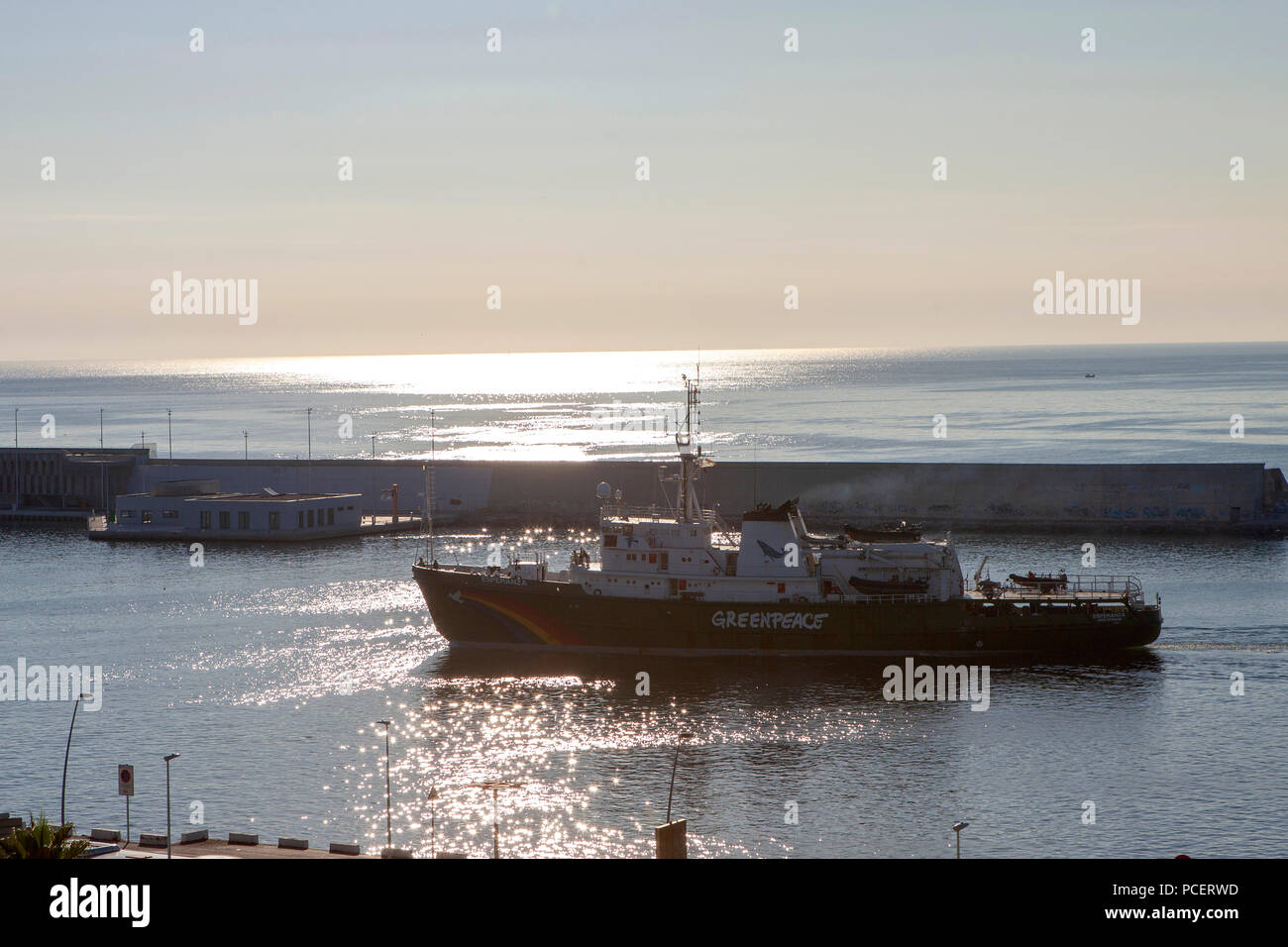 Greenpeace Esperanza ship entering Barcelona port during sunset Stock Photo
