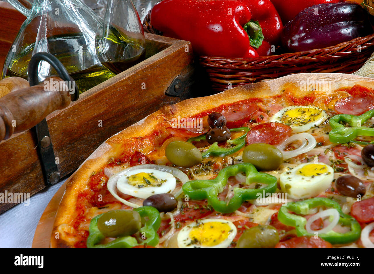 Portuguese Pizza, onion, peppers, pepperoni, egg, olive Stock Photo Alamy