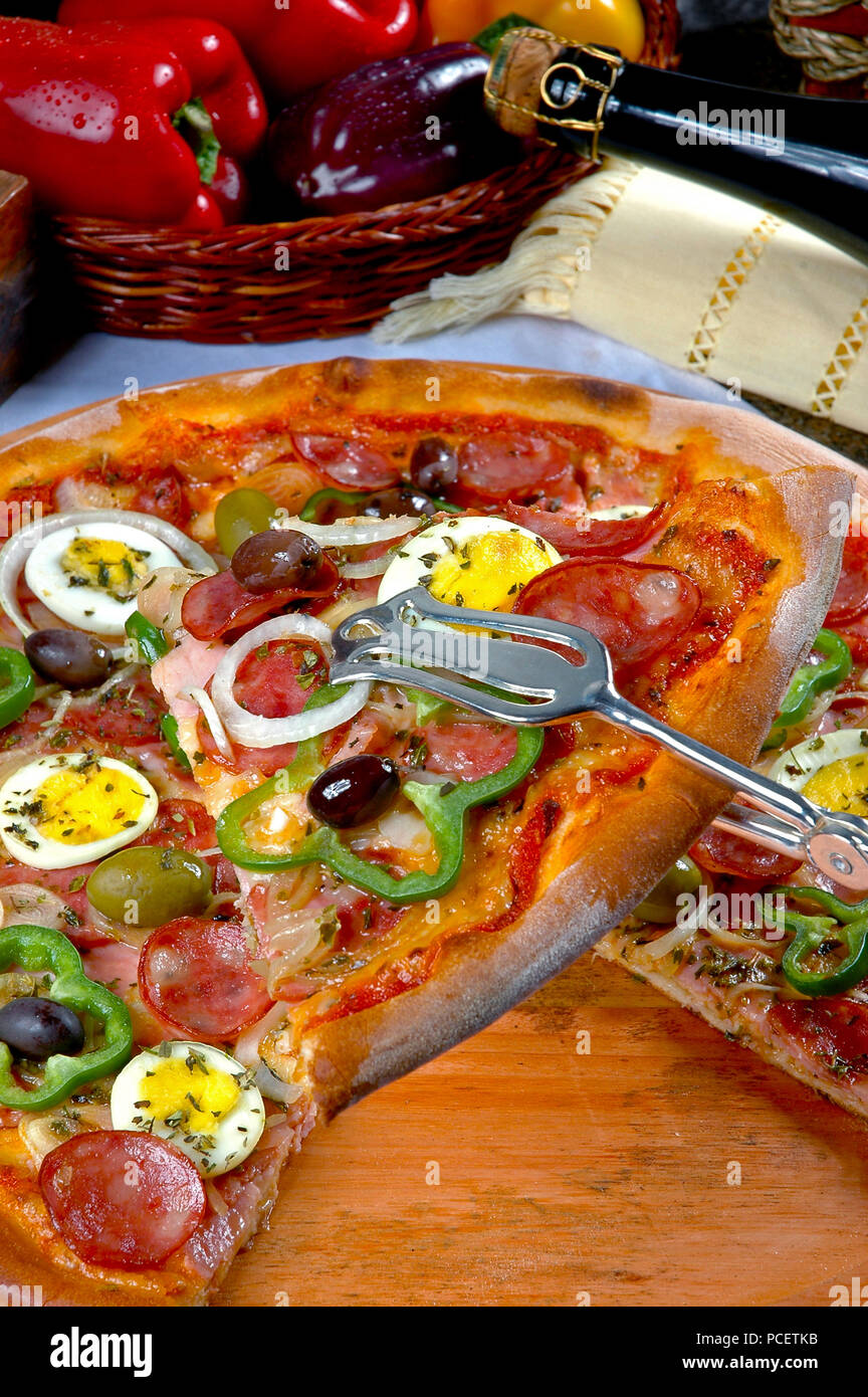 Portuguese Pizza, onion, peppers, pepperoni, egg, olive Stock Photo Alamy