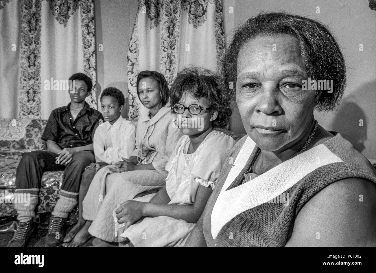 The mother of a murdered teen boy poses with her other children at home in the black ghetto of Dorchester, MA, in 1972. Stock Photo