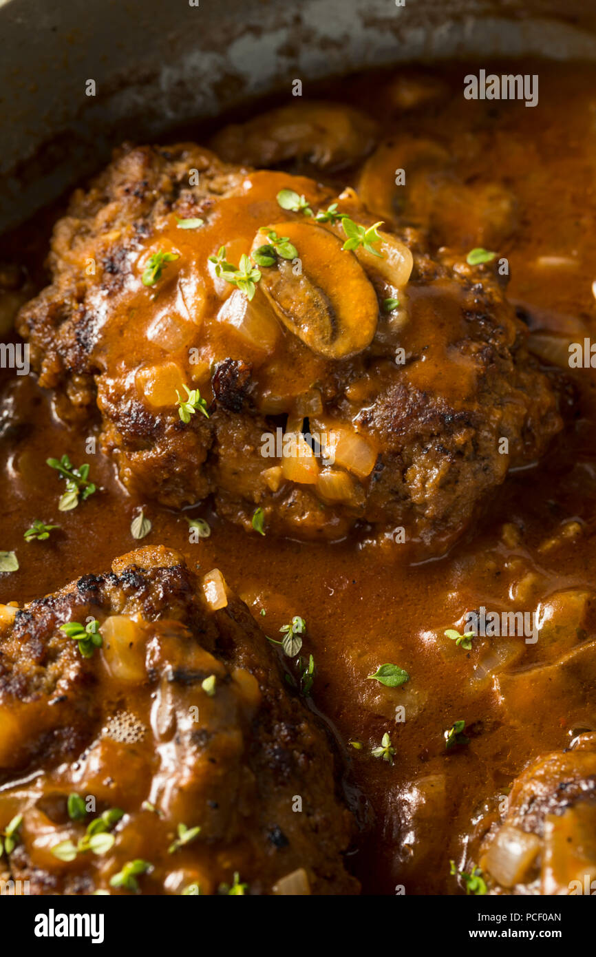 Homemade Savory Salisbury Steaks with Peas and Mashed Potatoes Stock Photo