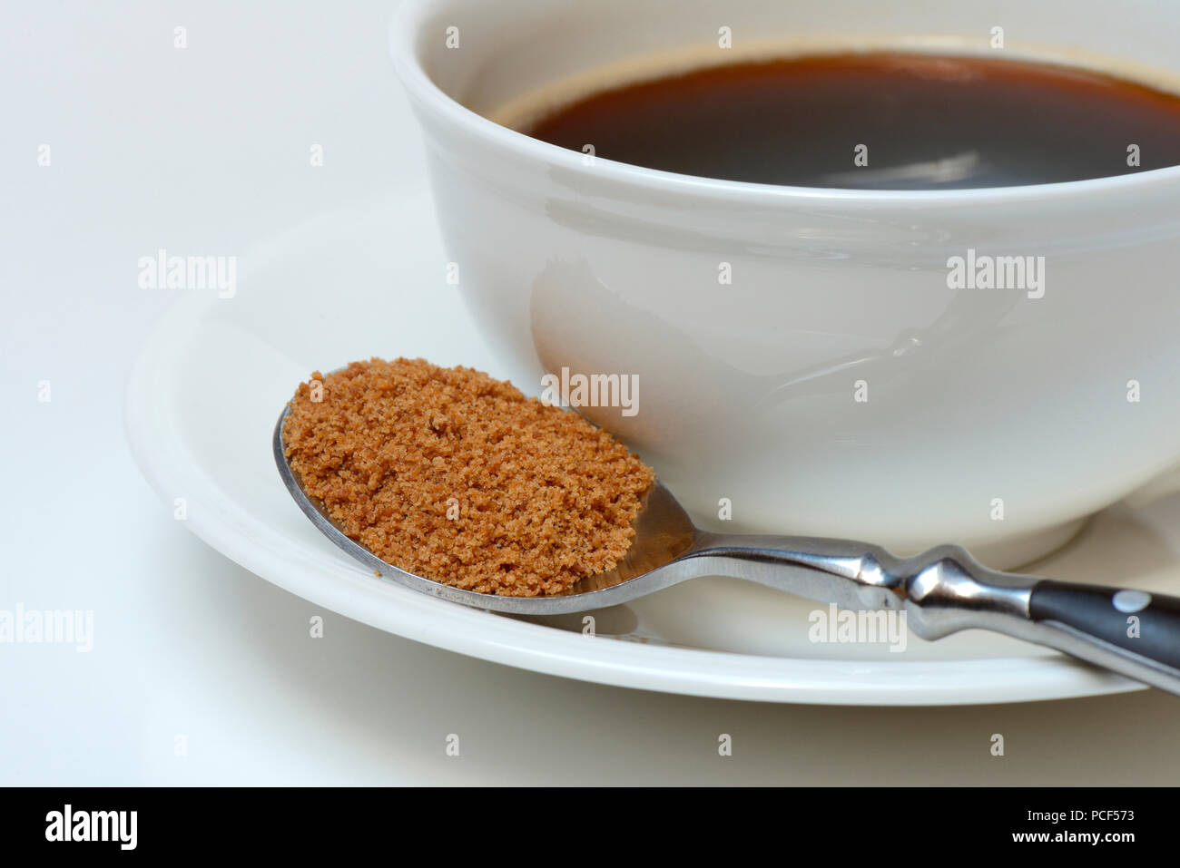 Loeffel mit Kokosbluetenzucker, Kaffeetasse mit Kaffee Stock Photo