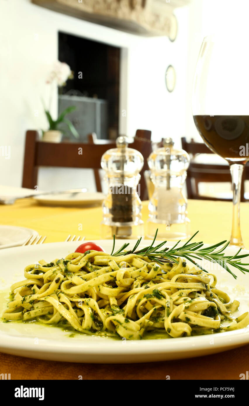 first course, tagliatelle with pesto and rosemary decorative Stock Photo