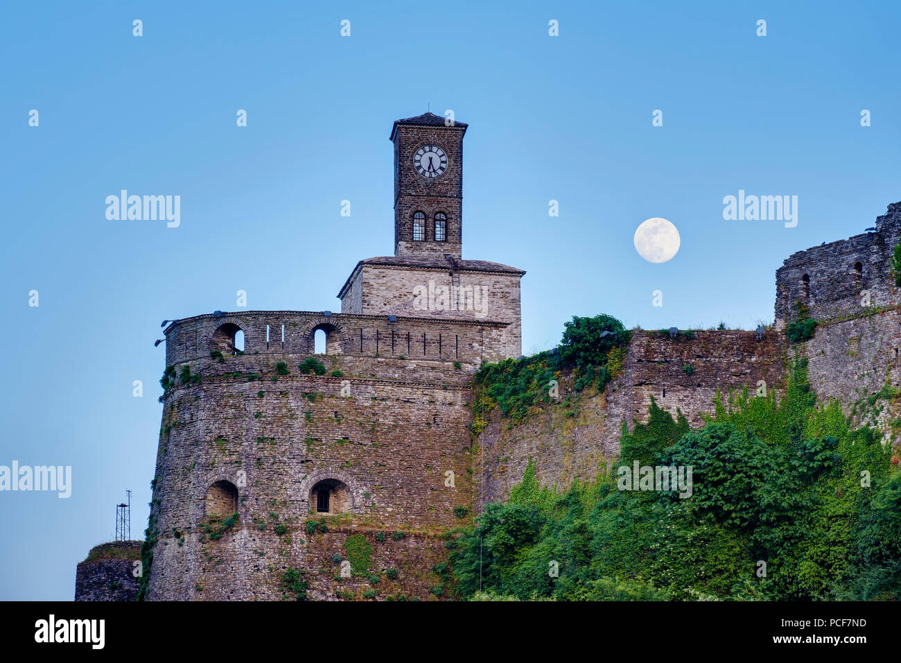 Clock tower on the castle at full moon, Gjirokastra, Gjirokastër, Albania Stock Photo