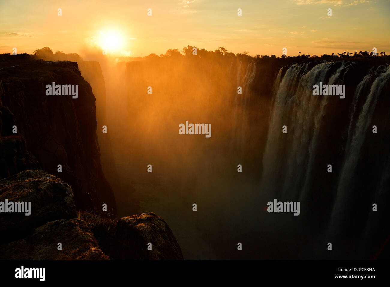 Victoria Falls in the haze, at sunset Zimbabwe, Africa Stock Photo