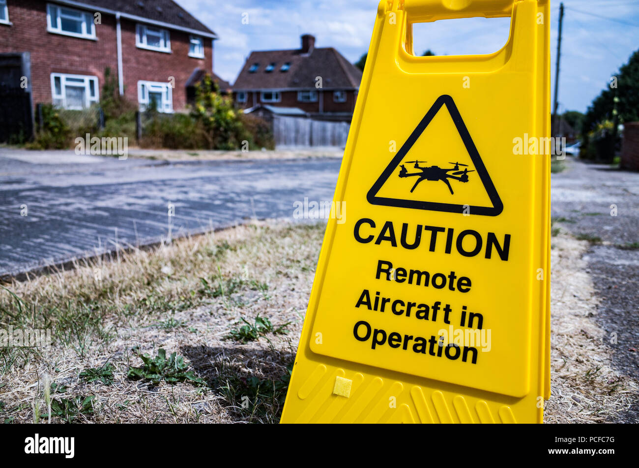 A-Frame style drone warning sign reading - Caution. Remote Aircraft in  Operation Stock Photo - Alamy