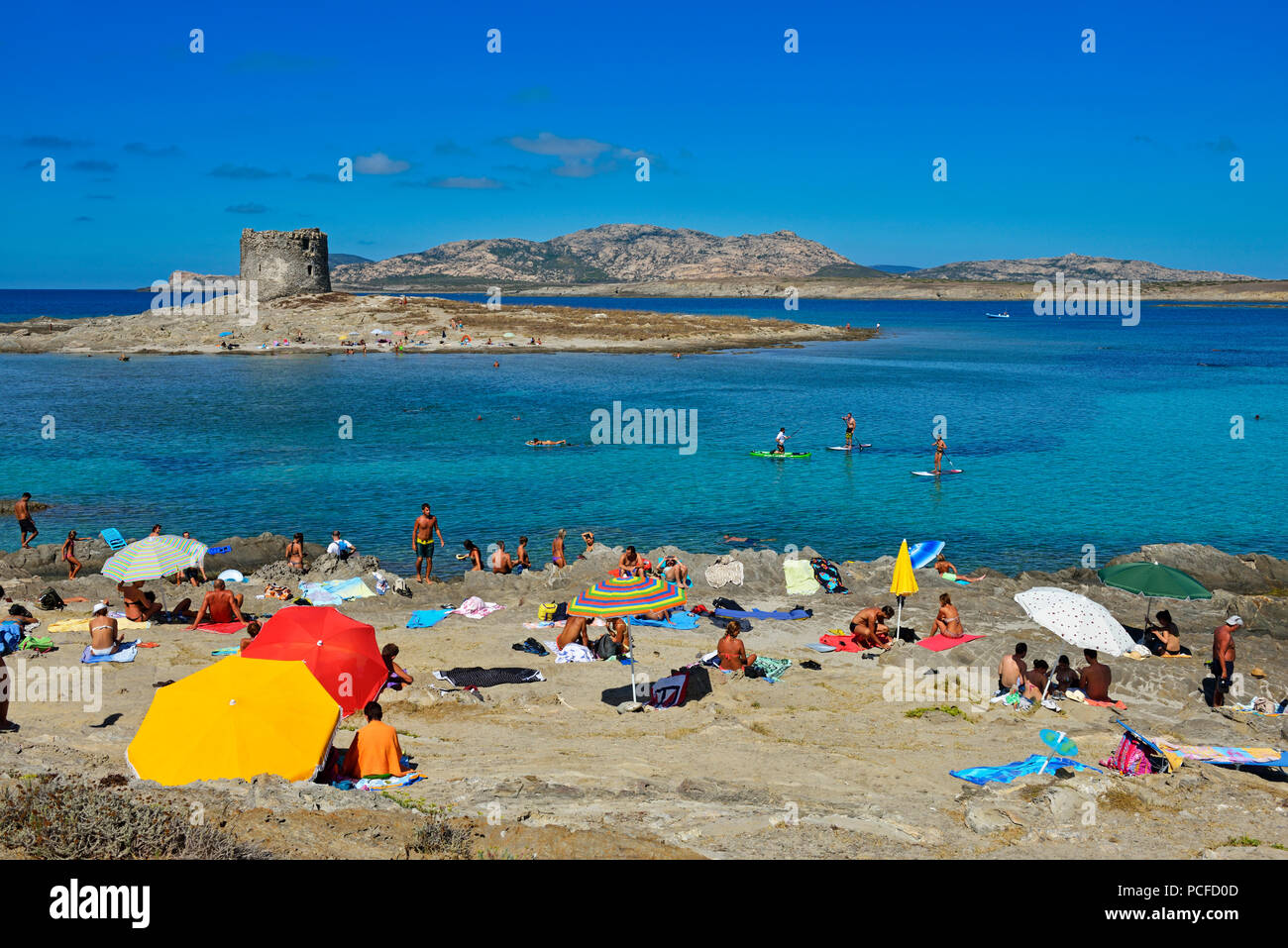 Beach with bathers at Stintino, Porto Torres, Sardinia, Italy Stock Photo -  Alamy