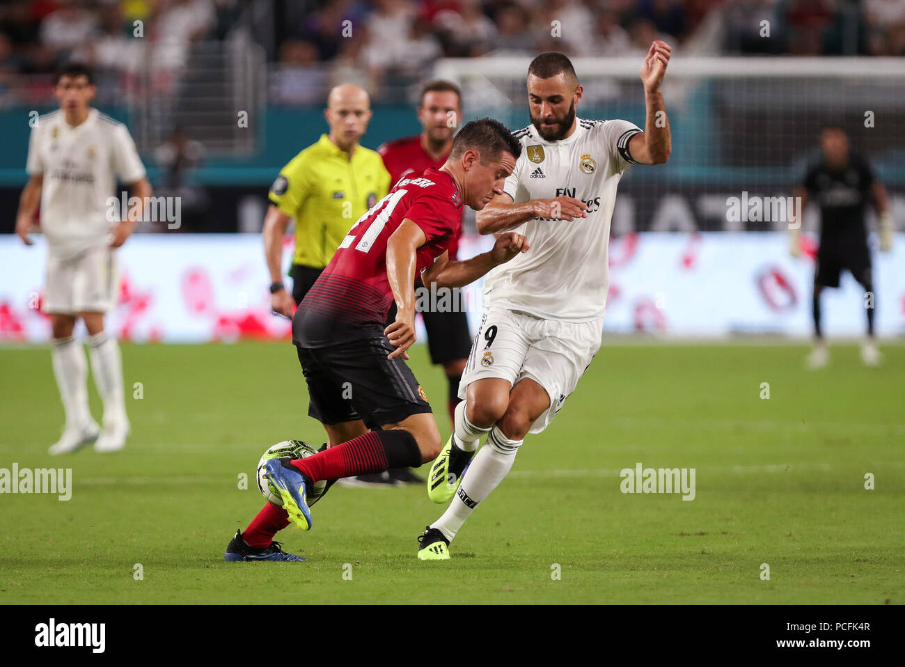 Miami Gardens, Florida, USA. 31st July, 2018. Manchester United F.C. midfielder Ander Herrera (21) fights for the ball with Real Madrid C.F. forward Karim Mostafa Benzema (9) during an International Champions Cup match between Real Madrid C.F. and Manchester United F.C. at the Hard Rock Stadium in Miami Gardens, Florida. Manchester United F.C. won the game 2-1. Credit: Mario Houben/ZUMA Wire/Alamy Live News Stock Photo
