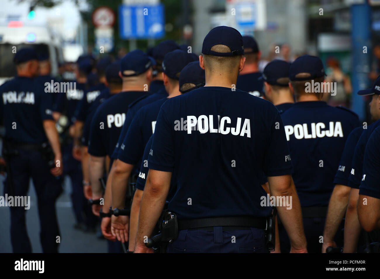 Poland, Warsaw, 1st August 2018: Celebrations on 74th anniversary of Warsaw Uprising in the center of Polish capitol. Masses of participants show flags and flare fires to remember of the city fighters of 1944 during World War II. ©Madeleine Ratz/Alamy Live News Stock Photo