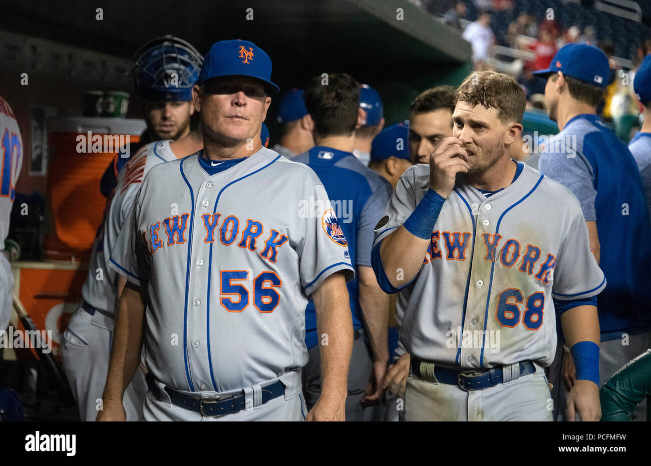 Washington, United States Of America. 31st July, 2018. New York Mets assistant hitting coach Tom Slater (56) and second baseman Jeff McNeil (68) in the dugout in the ninth inning against the Washington Nationals at Nationals Park in Washington, DC on Tuesday, July 31, 2018. The Nationals won the game 25 - 4. Credit: Ron Sachs/CNP (RESTRICTION: NO New York or New Jersey Newspapers or newspapers within a 75 mile radius of New York City) | usage worldwide Credit: dpa/Alamy Live News Stock Photo
