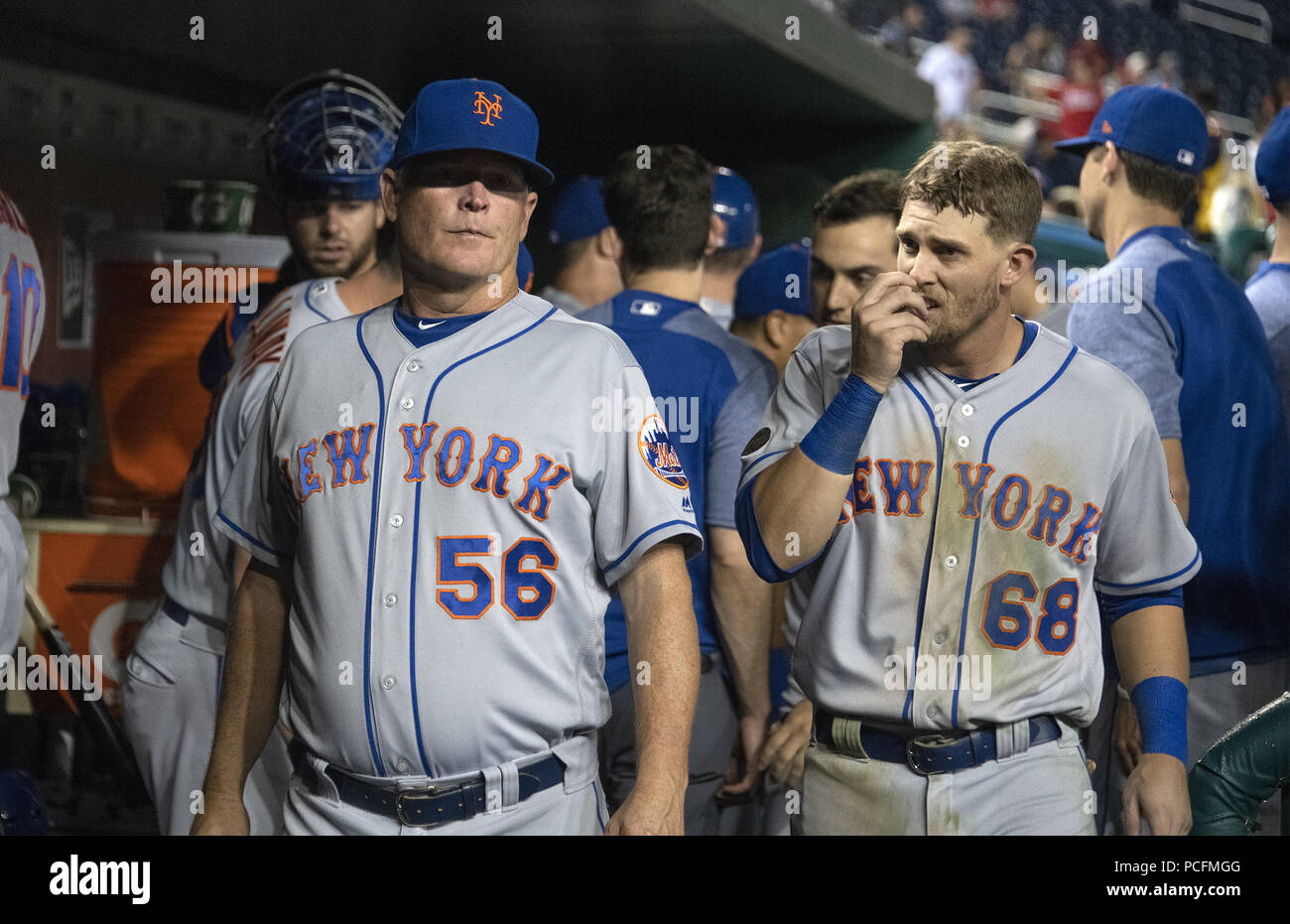 Washington, District of Columbia, USA. 31st July, 2018. New York Mets assistant hitting coach Tom Slater (56) and second baseman Jeff McNeil (68) in the dugout in the ninth inning against the Washington Nationals at Nationals Park in Washington, DC on Tuesday, July 31, 2018. The Nationals won the game 25 - 4.Credit: Ron Sachs/CNP. Credit: Ron Sachs/CNP/ZUMA Wire/Alamy Live News Stock Photo