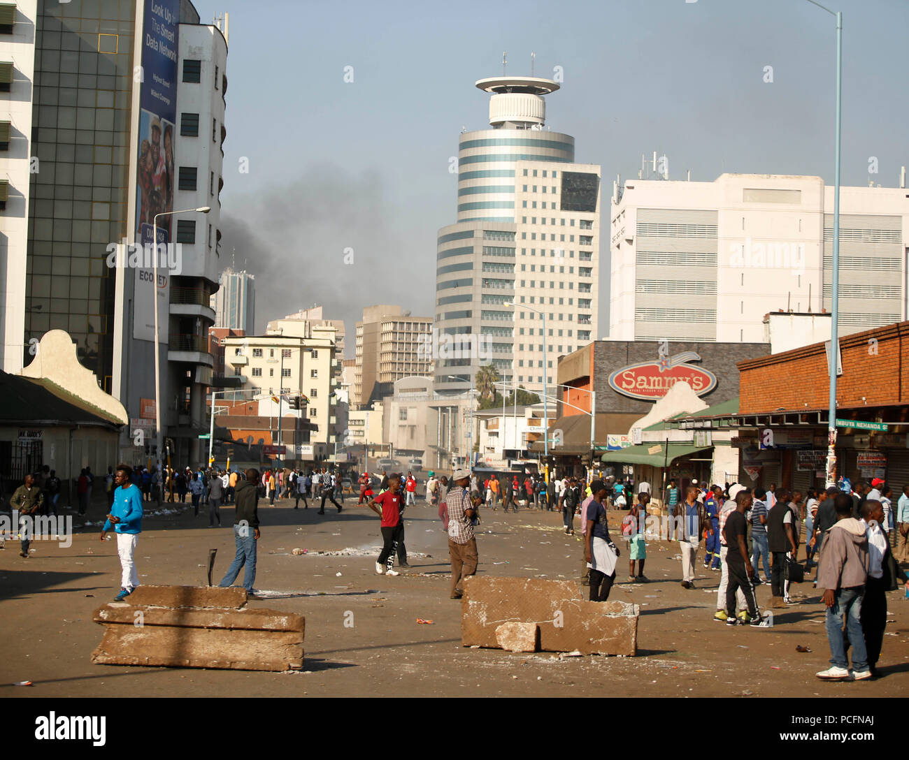 Harare, Zimbabwe. 1st Aug, 2018. Supporters of the opposition MDC Alliance attend a protest in Harare, Zimbabwe, Aug. 1, 2018. Three people died and scores of others were injured Wednesday when protesting opposition supporters clashed with army and police in the capital Harare. Scores of opposition supporters took to the streets of Harare to protest against the delay in announcement of presidential election results as well as alleged rigging of the vote. Credit: Shaun Jusa/Xinhua/Alamy Live News Stock Photo