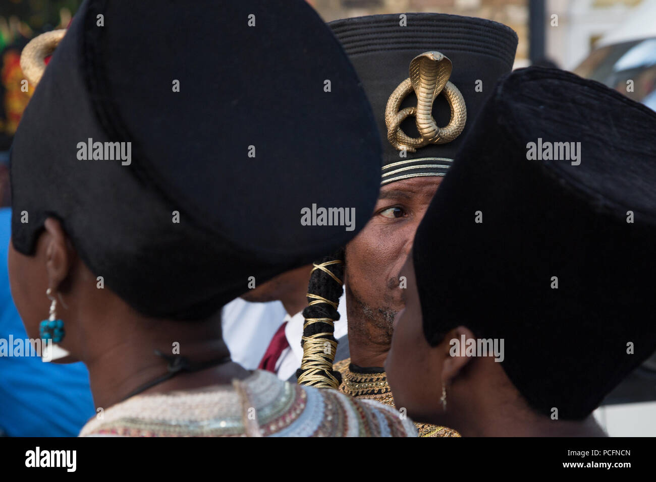 London UK 1st August 2018 A family in Windrush square during march to demand holistic reparatory justice for the African Holocaust. Credit: Thabo Jaiyesimi/Alamy Live News Stock Photo
