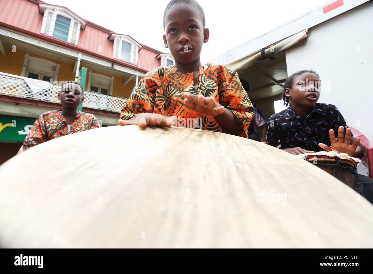 Port of Spain, Trinidad, Tobago. 1st Aug 2018. Drumming troupes perform on flatbed trucks during the annual Emancipation Day observance procession from Independence Square to the Lidj Yasu Omowale Emancipation Village in the Queens' Park Savannah on August 1, 2018 in Port of Spain, Trinidad. (Photo by Sean Drakes/Alamy Live News) Stock Photo