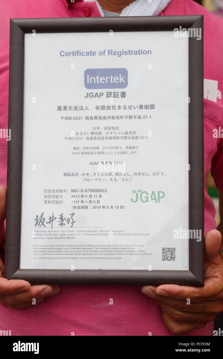 Seiichi Sato President Of Marusei Fruit Farm Shows The Jgap Japan Good Agricultural Practice Certificate Of His Fruit Farm Marusei Fruit Farm During The 1000km Relay To Tokyo 2018 Promotion Event In