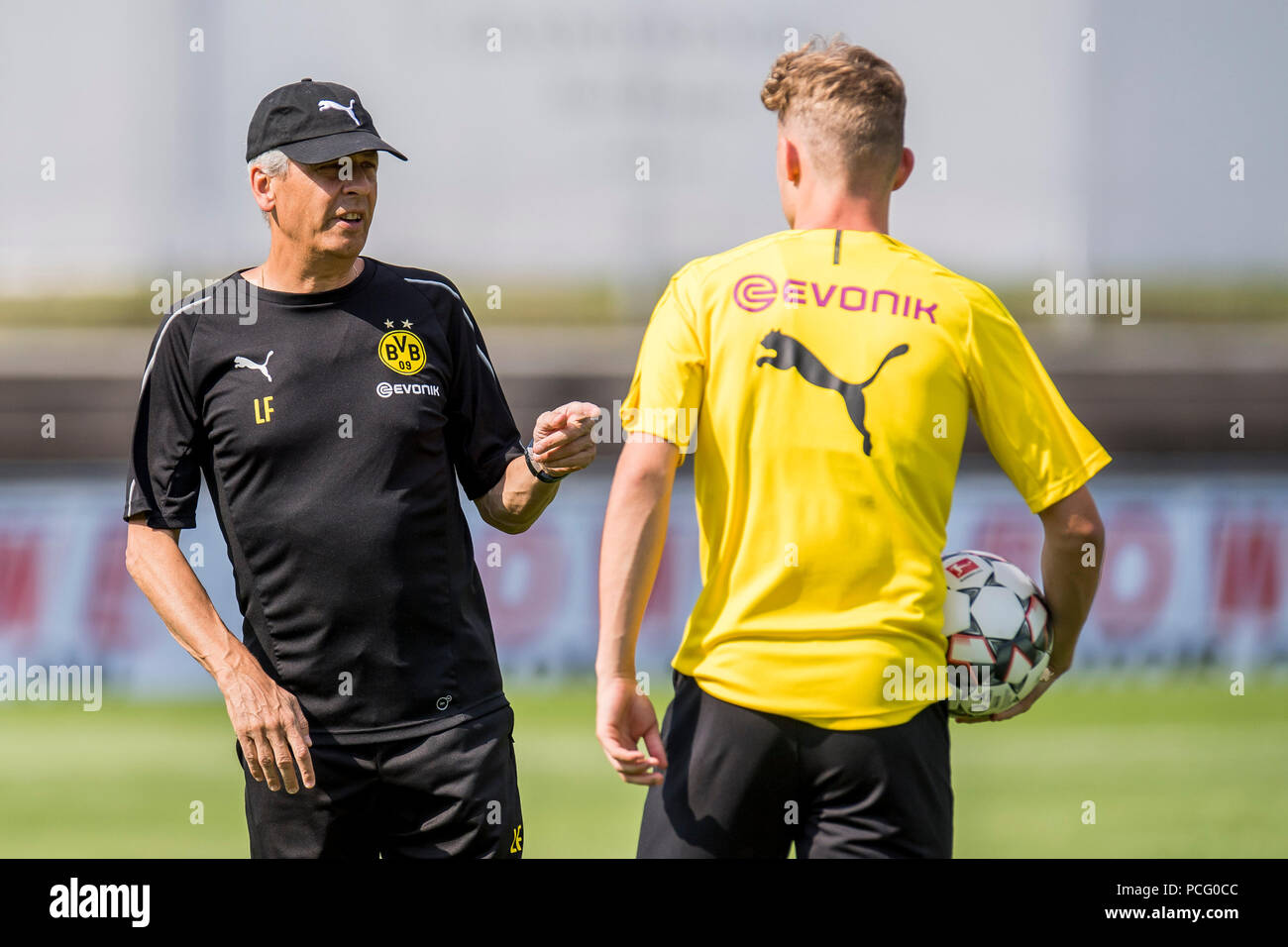 Bad Ragaz, Switzerland. 02nd Aug, 2018. Soccer, training camp Borussia  Dortmund. Dortmund's coach Lucien Favre (L) talks to player Dzenis Burnic.  Credit: David Inderlied/dpa/Alamy Live News Stock Photo - Alamy