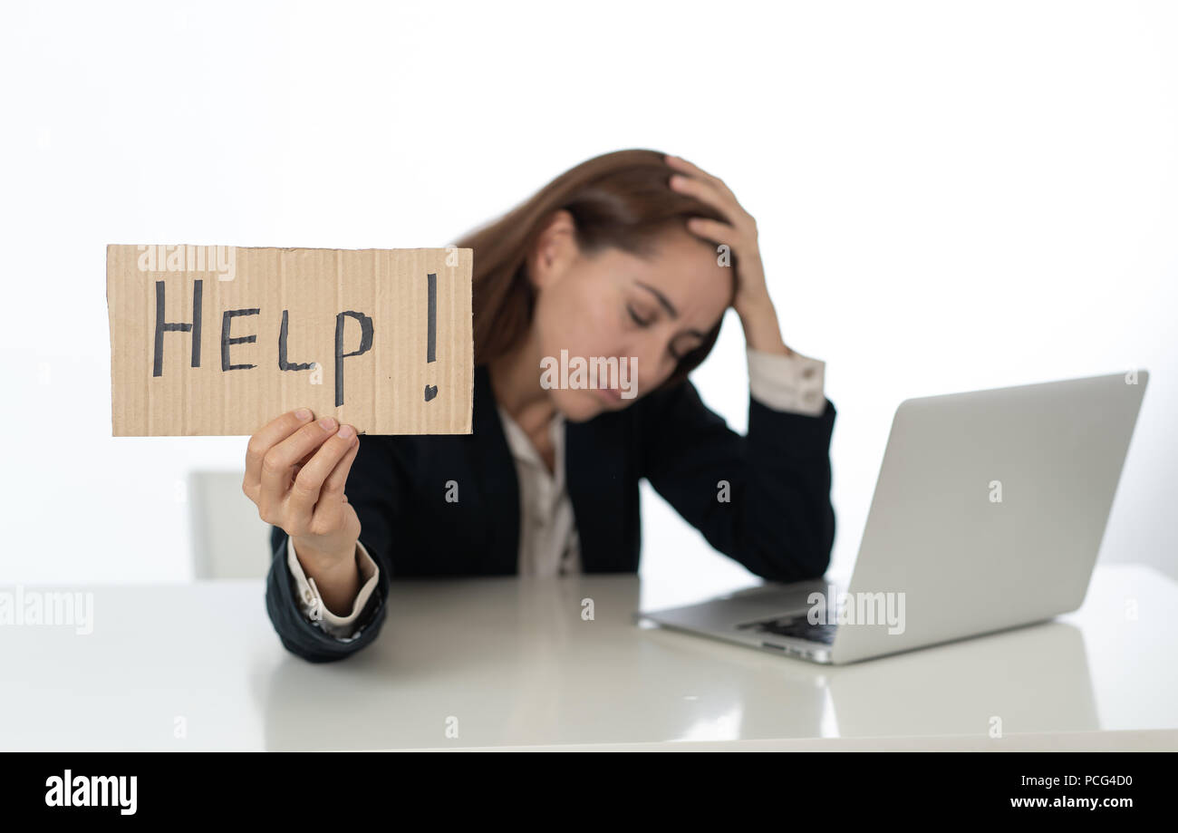 Stressed woman with laptop and sing help Stock Photo