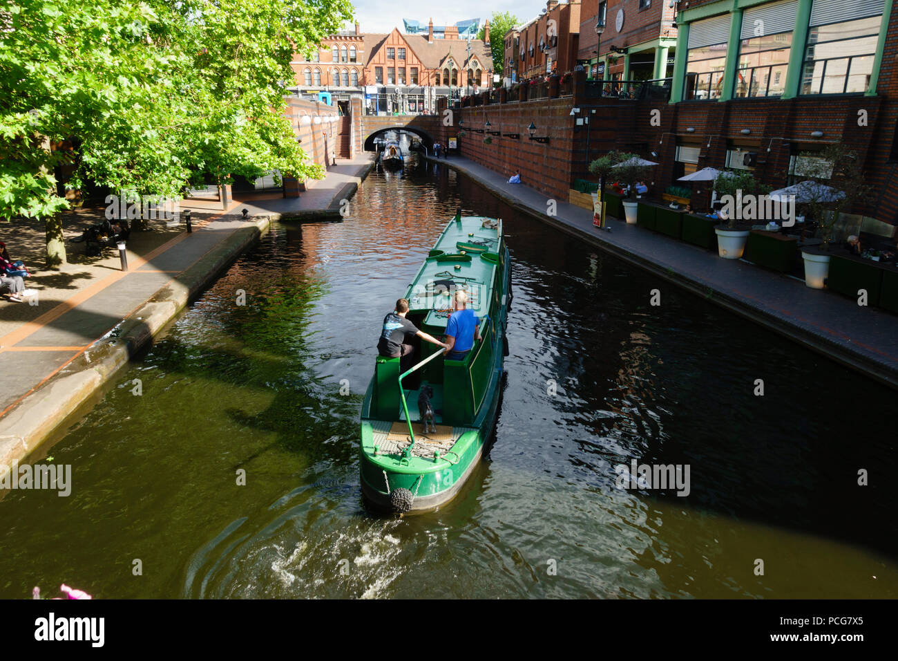 Canal barge going through Birmingham at Brindley Place, Birmingham, West Midlands, England Stock Photo