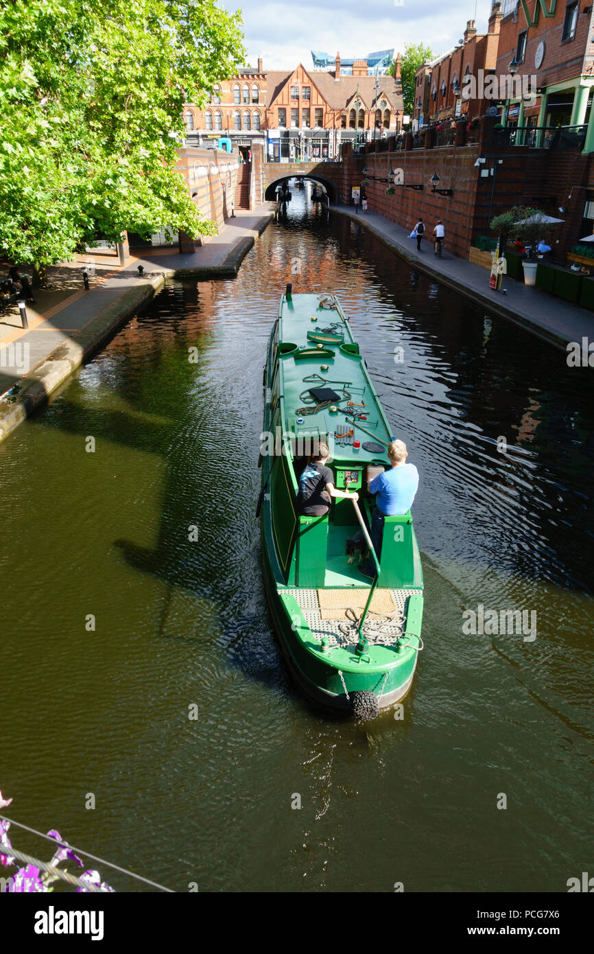 Canal barge going through Birmingham at Brindley Place, Birmingham, West Midlands, England Stock Photo
