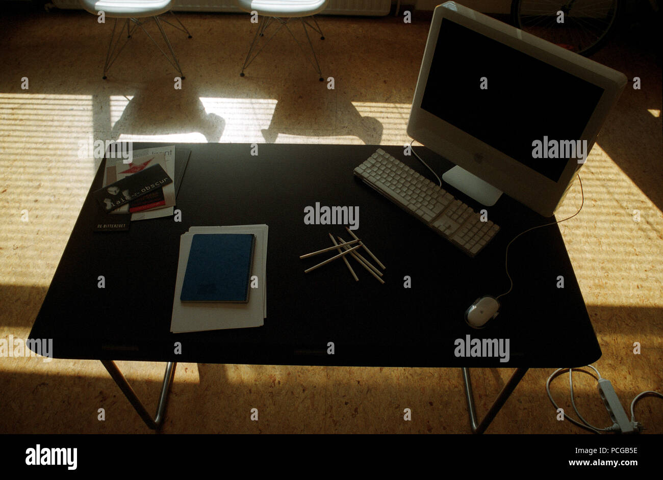 Office Desk Of A Graphic Designer With An Apple Imac Computer