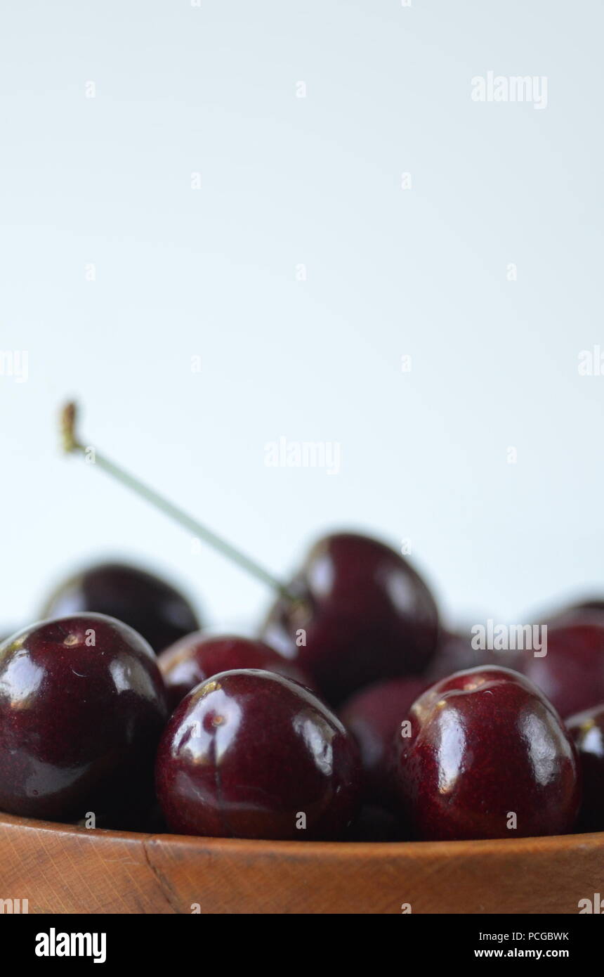 Detail of fresh summer fruit, berries. Direct front view of cherries with copy space Stock Photo