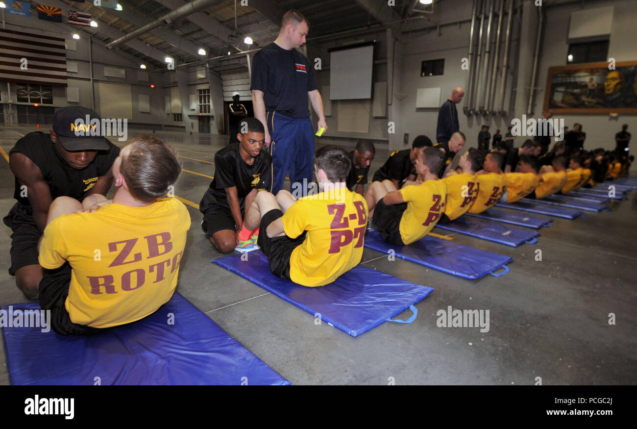 GREAT LAKES, Ill., (March 13, 2014) – Zion-Benton Township (Ill.) High School Navy Junior Reserve Officers Training Corps (NJROTC) Cadets perform curl-ups during the athletic event of the 2015 Area 3 West Regional Academic, Athletic and Drill competition at Recruit Training Command (RTC) here, March 13. More than 600 cadets from 15 Navy Junior ROTC units in Illinois and Minnesota participated in the two-day event. Zion-Benton finished first overall at the two-day competition. Zion and East Aurora (Ill.) High School (second place) will compete in the Academic, Athletic and Drill Nationals compe Stock Photo