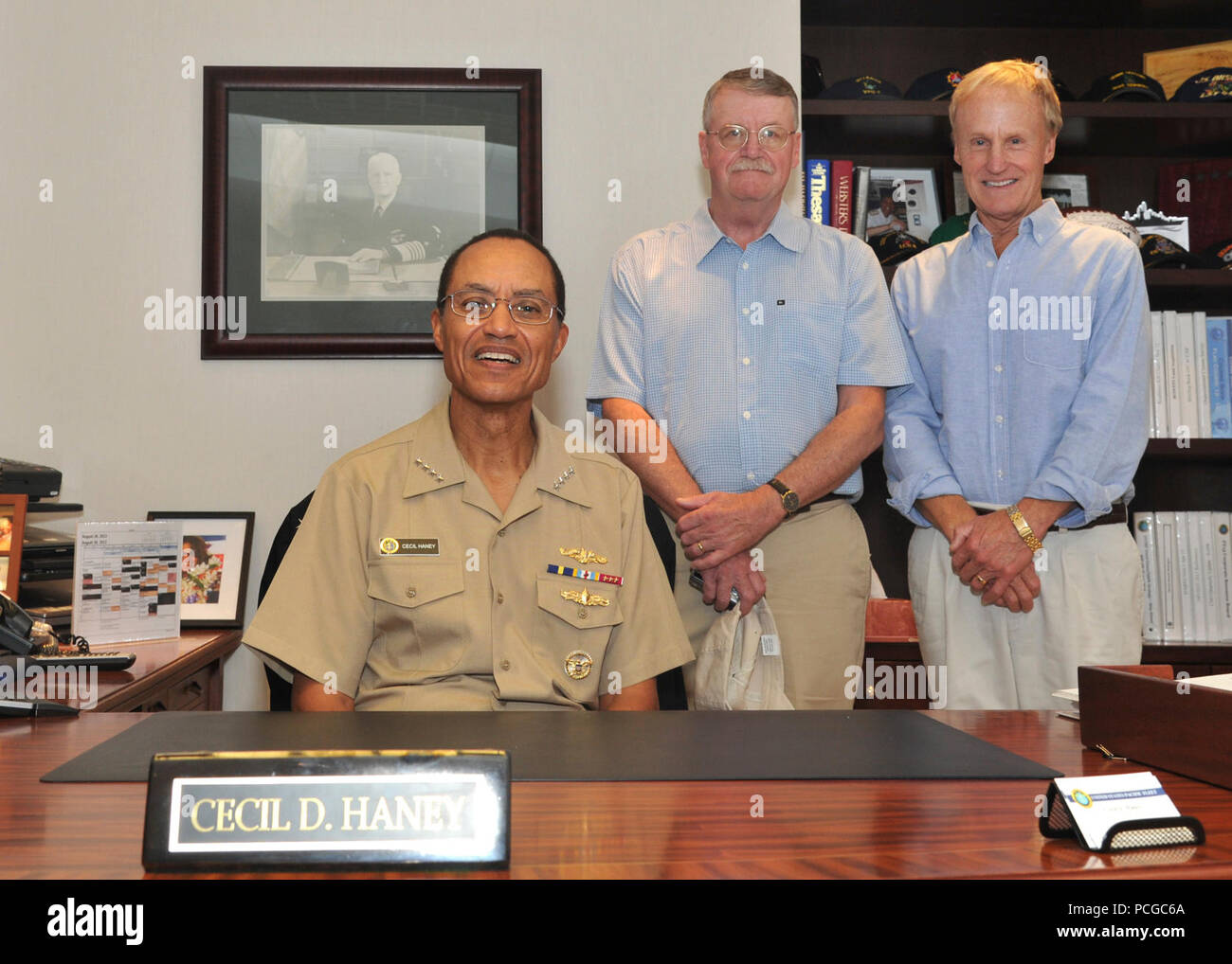 Adm. Cecil D. Haney, commander of U.S. Pacific Fleet, Richard Lay and Chester Nimitz Lay, grandsons of fleet Adm. Chester Nimitz, pose for a Stock Photo