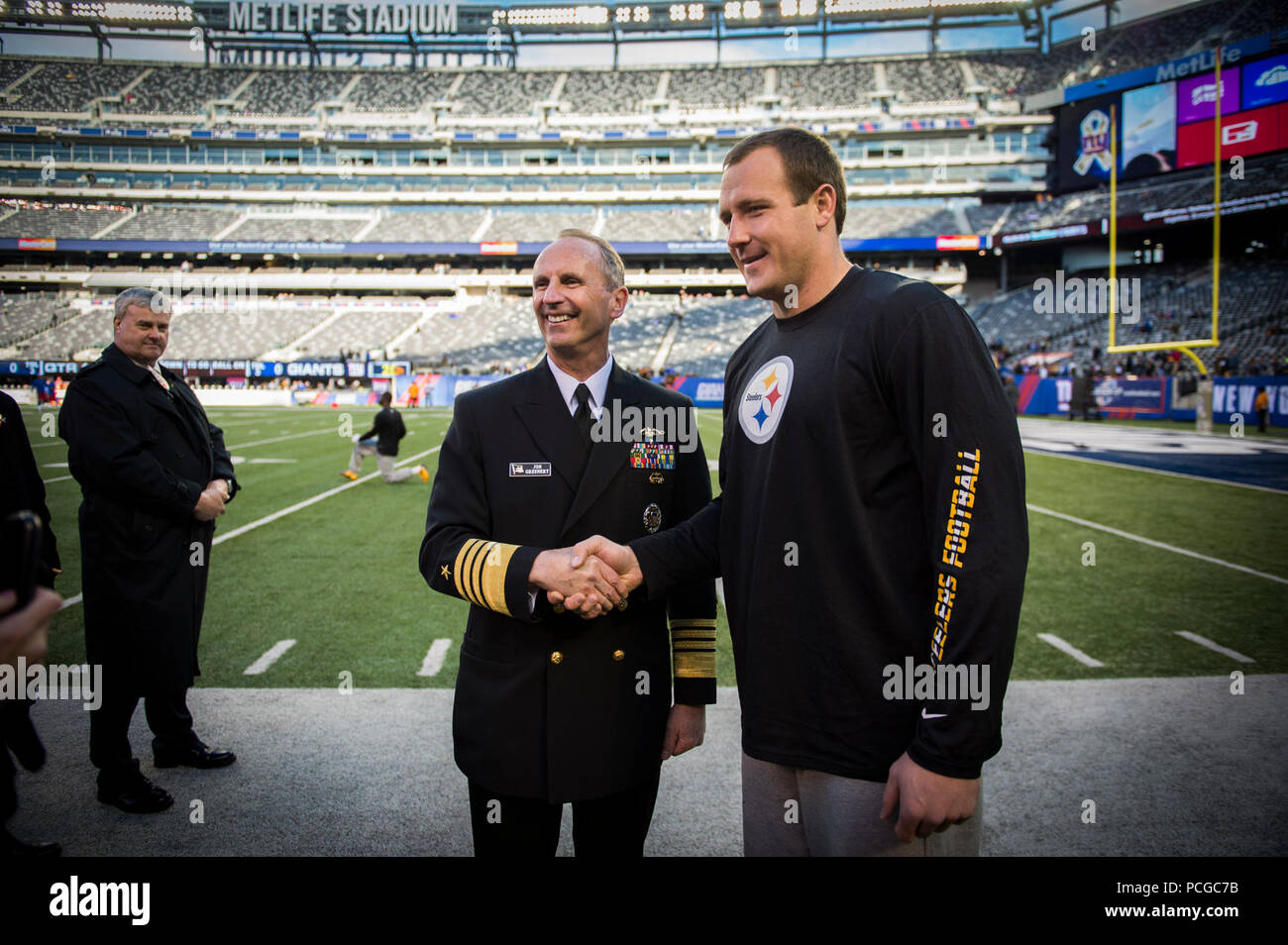 RUTHERFORD, N.J. (Nov. 4, 2012) Chief of Naval Operations (CNO) Adm. Jonathan Greenert meets Pittsburgh Steelers tight end Heath Miller before an NFL military appreciation game at Metlife Stadium where the New York Giants hosted the Steelers. The NFL chose November in conjunction with Veteran's Day to honor the military with their 'Salute to Service' campaign, highlighting service members' contribution to our nation. Stock Photo