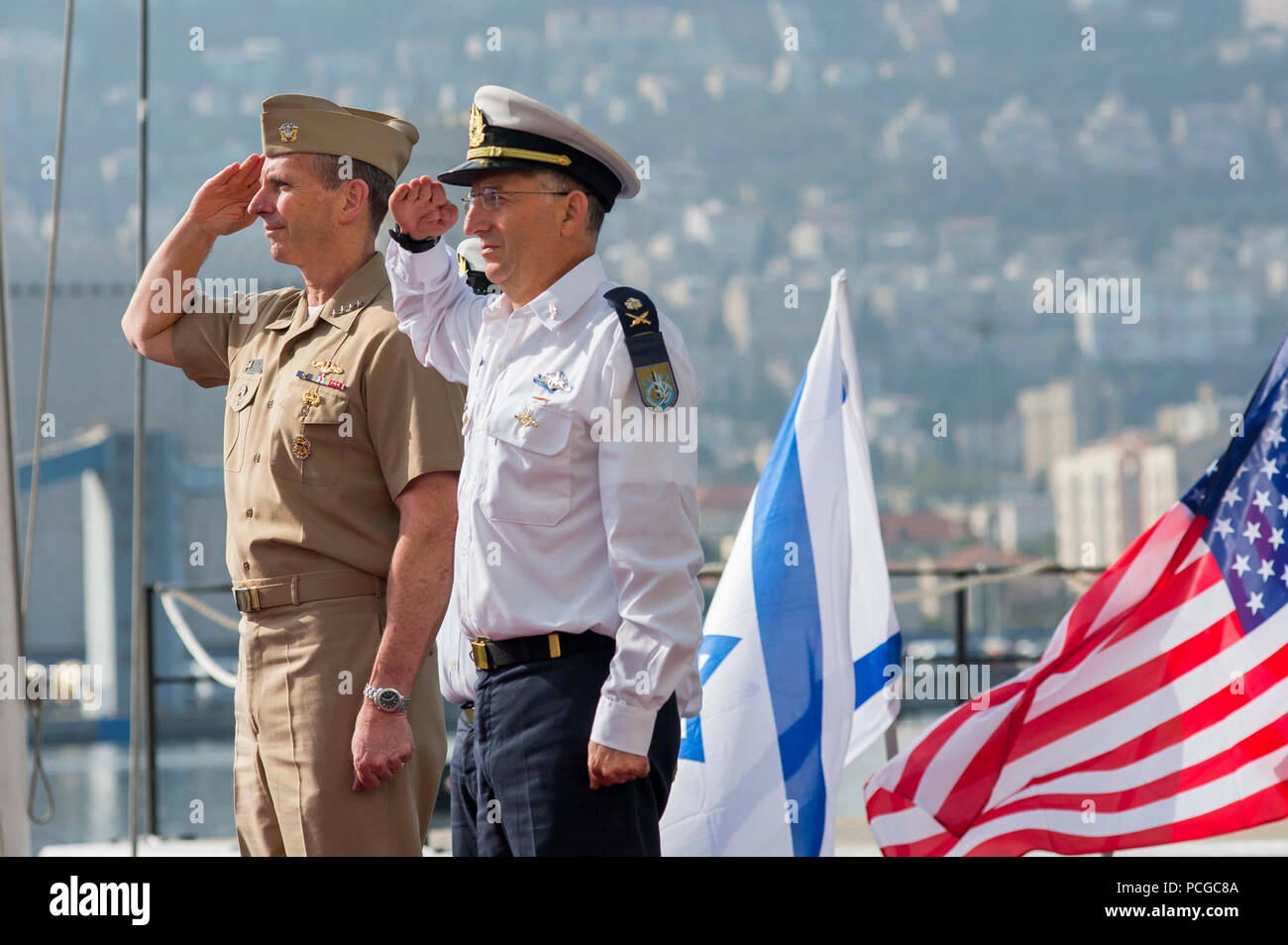 Israel (Nov. 24, 2013) Chief of Naval Operations (CNO) Adm. Jonathan Greenert salutes with the Commander in Chief of the Israel Navy Vice Adm. Ram Rutberg during a full honors ceremony to welcome him upon his arrival at Haifa Naval Base. During the visit, Greenert observed several capabilities demonstrations conducted by the IN and conducted engagement meetings with Israel Defense Force leadership. Stock Photo