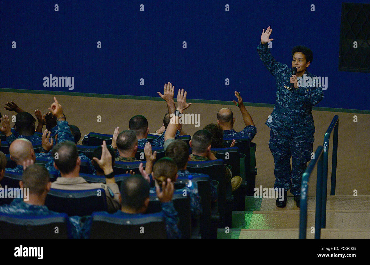 NAS SIGONELLA, Sicily (Aug. 1, 2016) Commander, U.S. Naval Forces Europe-Africa, Adm. Michelle Howard poses a question to the audience during an all-hands call at the Naval Air Station (NAS) Sigonella base theater, Aug. 1. NAS Sigonella enables the forward operations and responsiveness of U.S. and allied forces in support of Navy Region Europe, Africa, Southwest Asia's mission to provide services to the Fleet, Fighter, and Family. Stock Photo