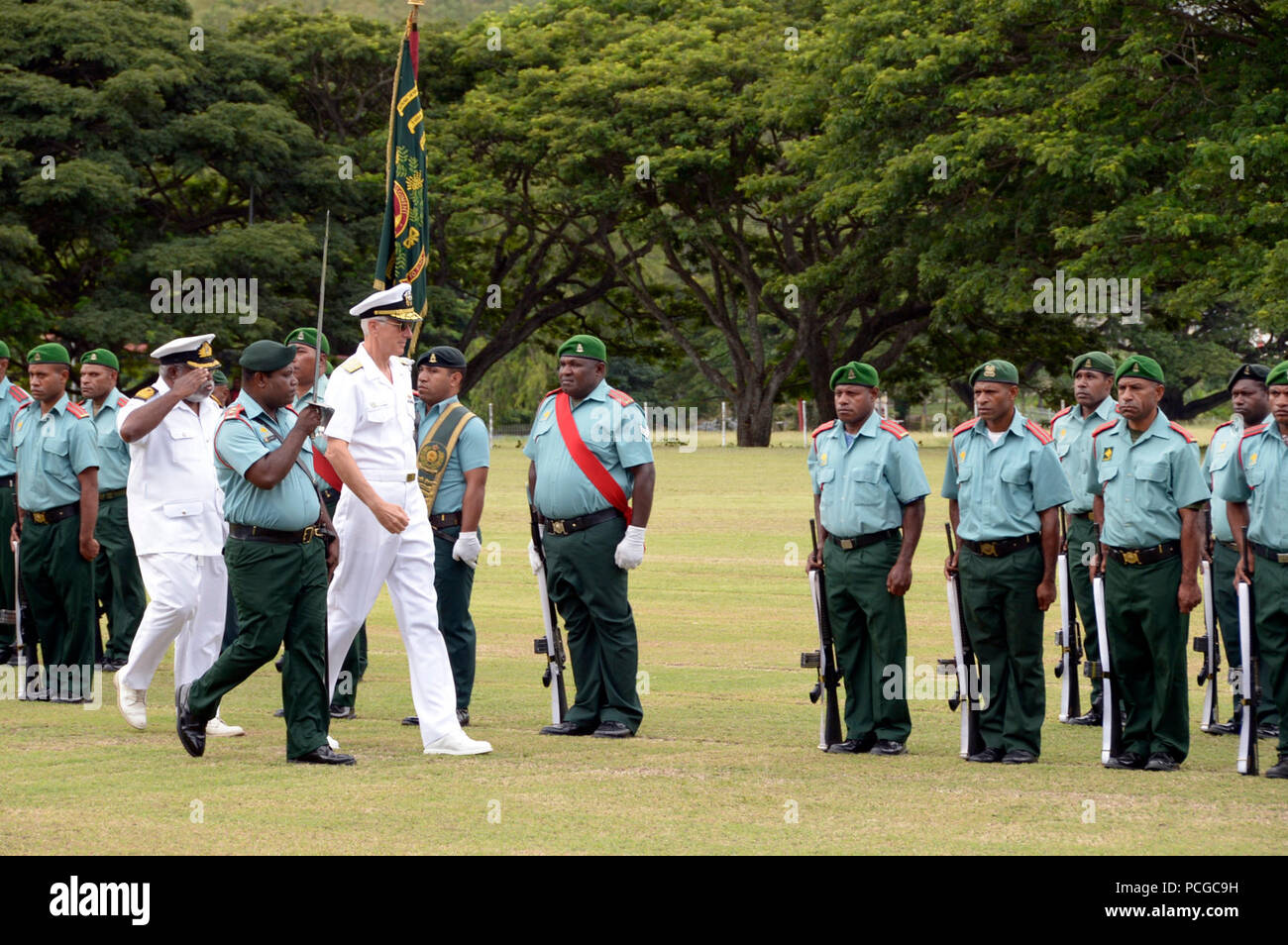 PORT MORESBY, Papua New Guinea (April 15, 2014)  Adm. Samuel J. Locklear, III, commander of U.S. Pacific Command, conducts an open ranks inspection at Murray Barracks as part of welcome parade. Locklear is in Papua New Guinea to meet with the country's political and military leaders to reaffirm the U.S-Papua New Guinea bilateral relationship and the strength of the partnership. Stock Photo