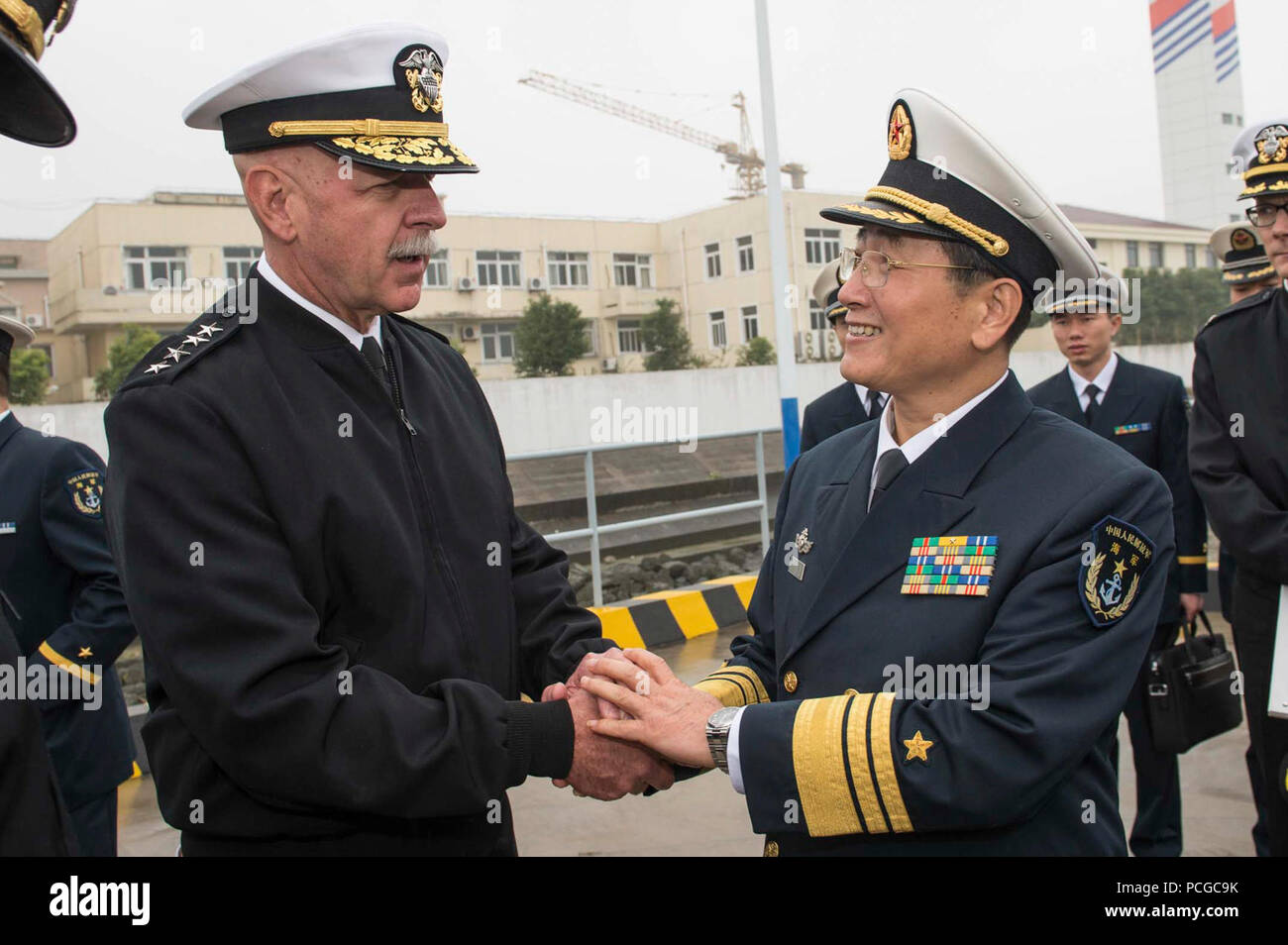 SHANGHAI (Nov. 17, 2015) Adm. Scott H. Swift, commander U.S. Pacific Fleet, greets Vice Adm. Su Zhiqian, the East Sea Fleet Commander of Chinese People’s Liberation Army (Navy), after touring the PLA Navy Jiangkai II class guided-missile frigate Xuzhou (FFG 530), during a scheduled port visit of the forward-deployed Arleigh Burke-class guided missile destroyer USS Stethem (DDG 63). Stethem is in Shanghai to build relationships with the PLA Navy and demonstrate the U.S. Navy’s commitment to the Indo-Asia-Pacific. Stock Photo