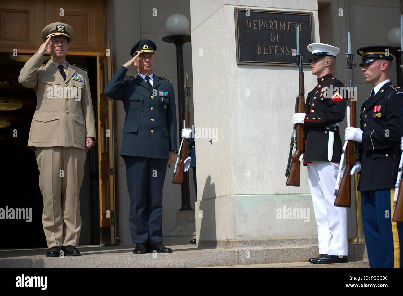 Chairman of the Joint Chiefs of Staff Adm. Mike Mullen, U.S. Navy, welcomes Supreme Commander of the Swedish Armed Forces Gen. Sverker Goranson to the Pentagon on Aug. 5, 2010. Stock Photo