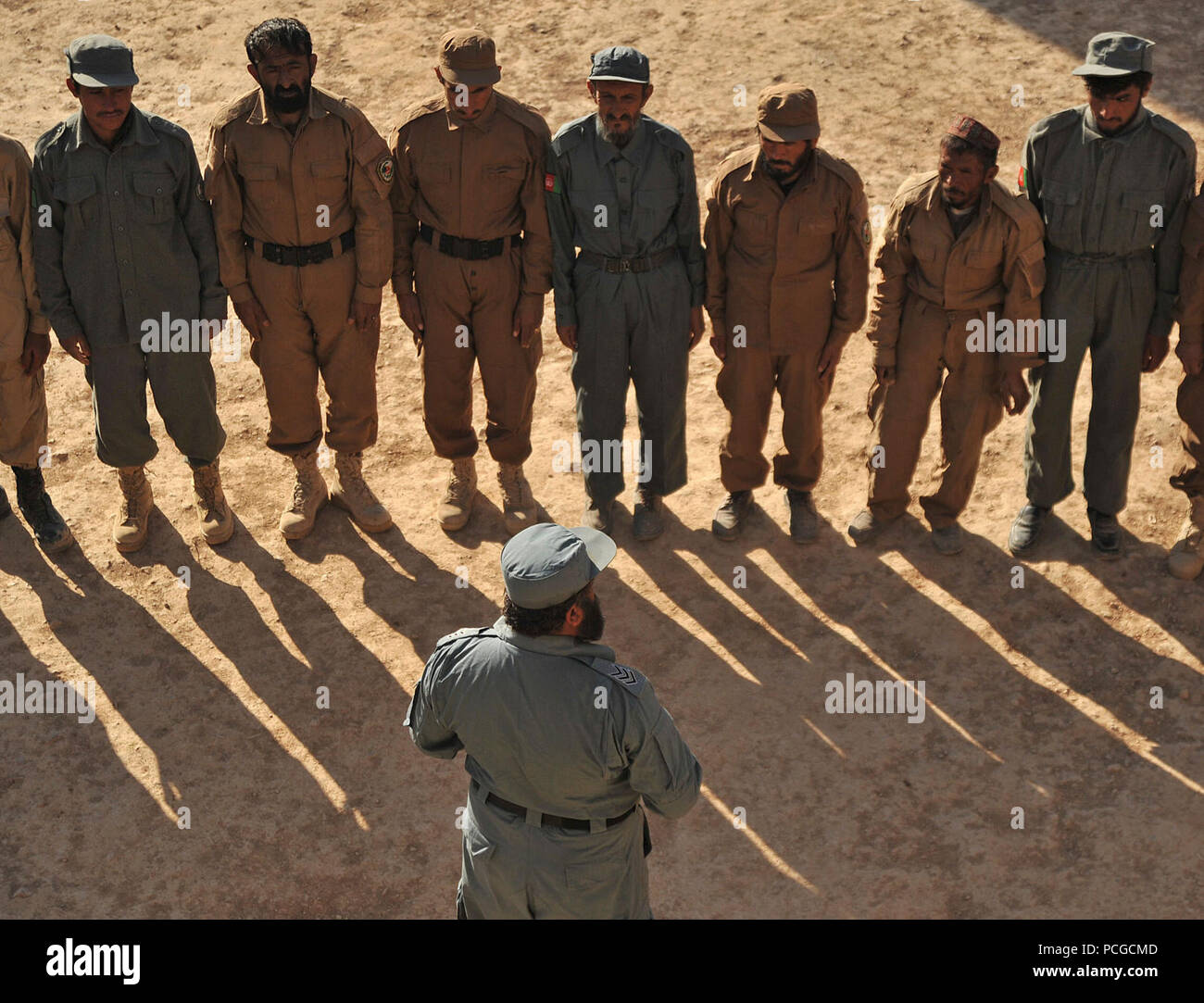 Afghan Local Police recruits stand in formation as they listen to ALP instructors during the academy's opening ceremony in Gizab district, Uruzgan province, Afghanistan, Dec 28. The ALP is a defensive, community-oriented force that brings security and stability to rural areas of Afghanistan. Stock Photo