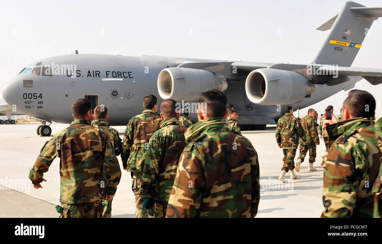 Afghan National Army soldiers walk to their C-17 cargo plane as it finishes fueling for their flight to Turkey on March 5 at the International Security Assistance Force airport in Kabul. The soldiers will be flying to turkey to receive training in leadership and the military skills required to operate as a special operations unit. Stock Photo