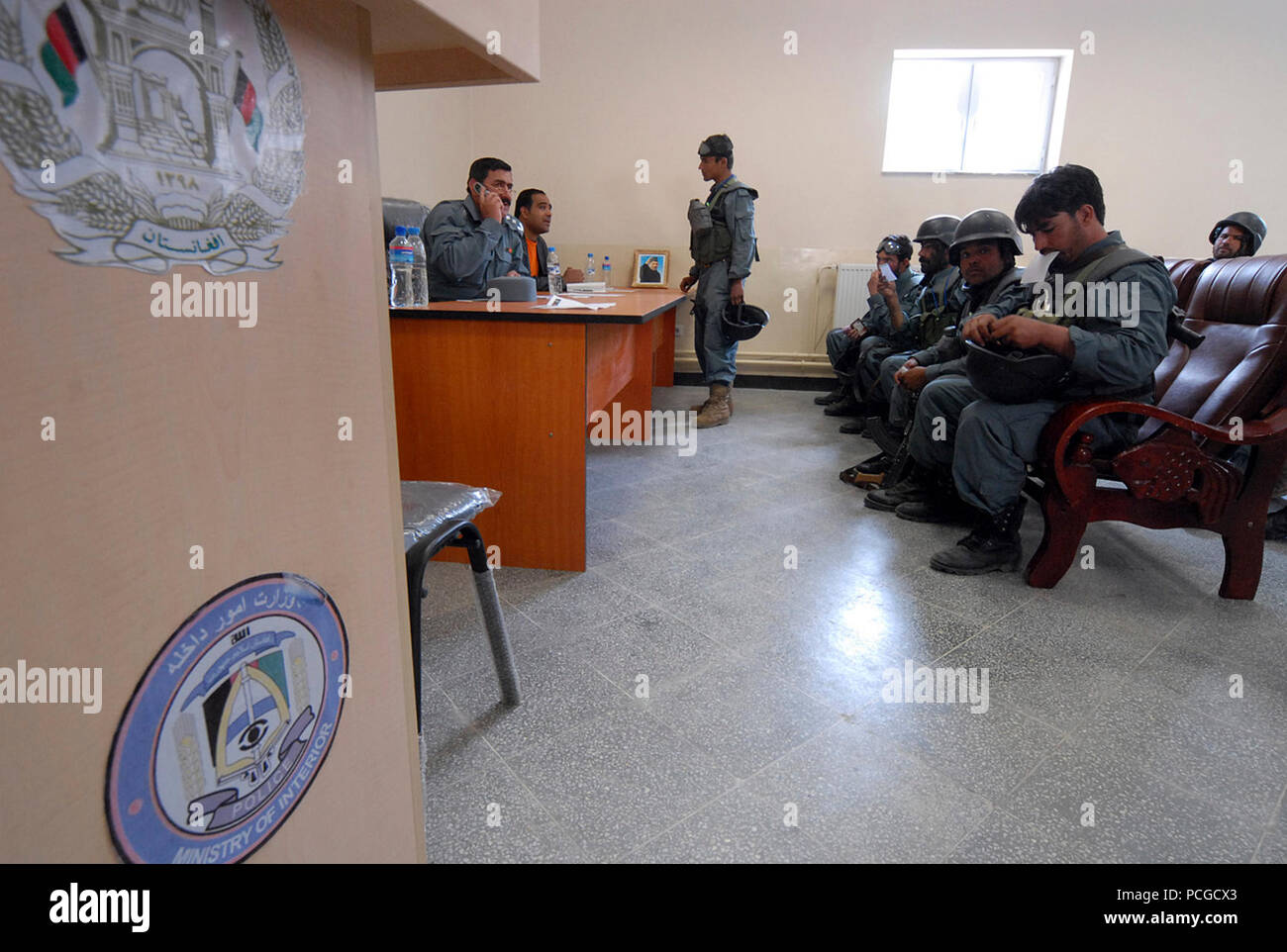 KABUL, Afghanistan (April 18, 2010) – Afgahn Col. Khuda yar Toutakhil, Finance Officer, 4th Brigade Afghan National Civil Order Police (ANCOP), far left, briefs members of the elite force on pay and benefits at a Kabul facility.  The police officers registered and received briefings and training as they prepare for operations in Afghanistan. (US Navy Stock Photo