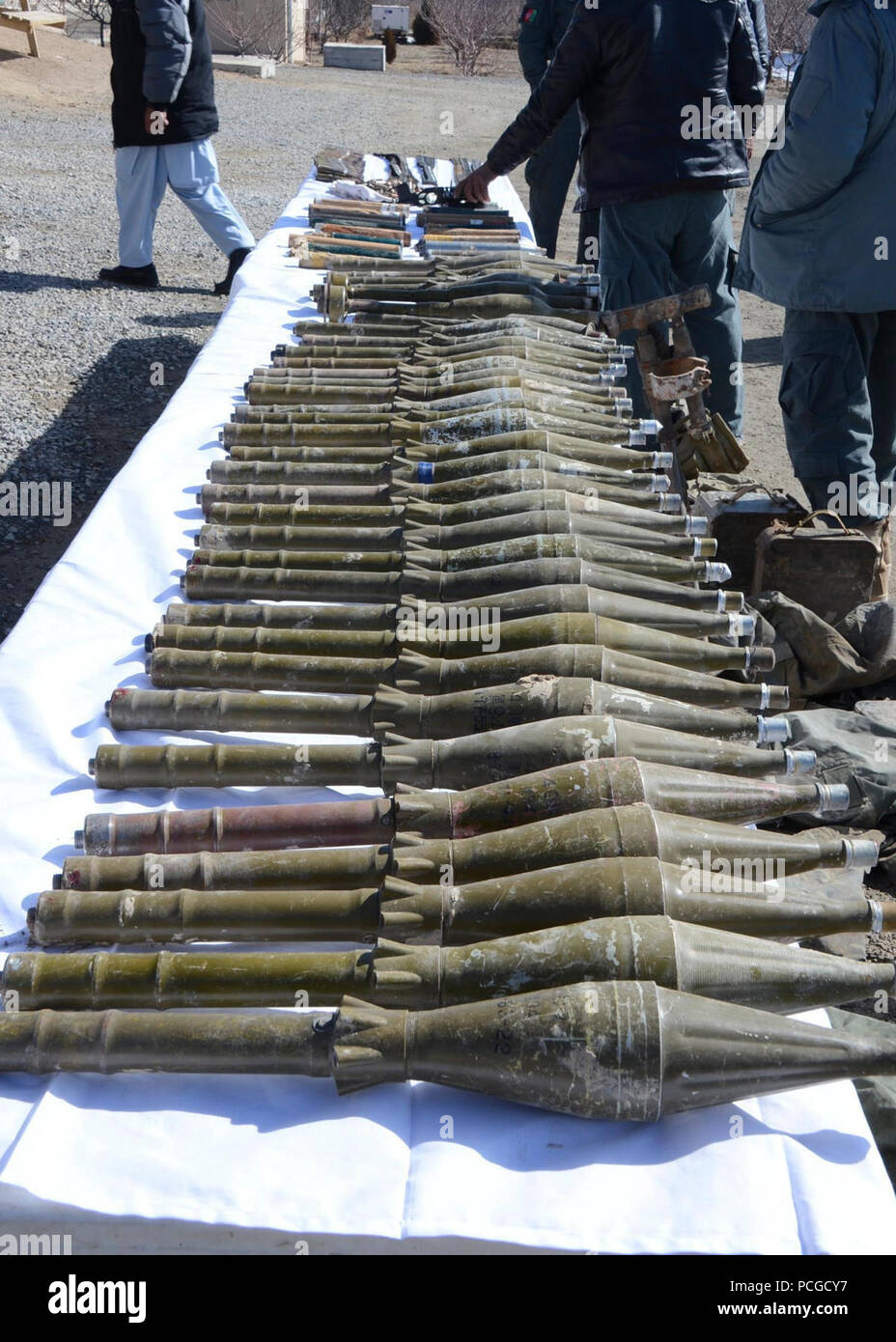 A weapons cache, seized during an Afghan independent combat operation, is seen on display during an awards ceremony Feb. 15, 2014, in Logar Province's Muhammed Agah District Center, Afghanistan. Afghan National Army Special Forces and Afghan Local Police discovered the cache in Babus village, Pul-E-Alam District. Stock Photo