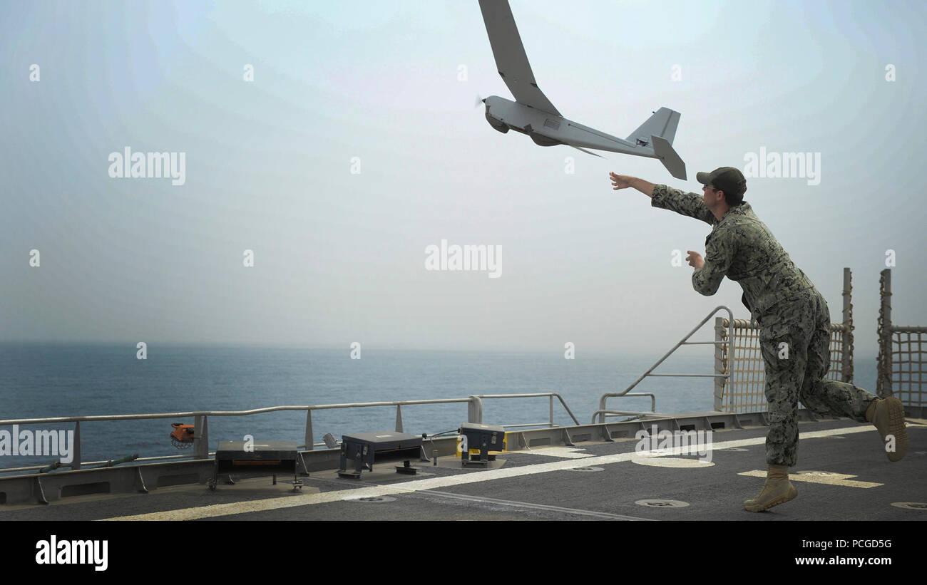 ATLANTIC OCEAN (Jan. 29, 2015) Information Technology Specialist 2nd Class Joshua Lesperance launches a Puma unmanned aerial vehicle during maritime law enforcement operations aboard the USNS Spearhead (JHSV 1), Jan. 29, 2015. Spearhead is on a scheduled deployment to the U.S. 6th Fleet area of operations in support of the international collaborative capacity-building program Africa Partnership Station. Stock Photo