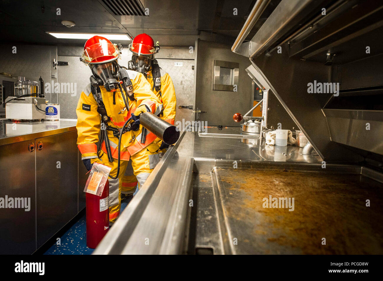 GULF OF GUINEA (March 31, 2015) Civil service mariners participate in a fire drill aboard the Military Sealift Command’s joint high-speed vessel USNS Spearhead (JHSV 1) March 31, 2015. Spearhead is on a scheduled deployment to the U.S. 6th Fleet area of operations in support of the international collaborative capacity-building program Africa Partnership Station. Stock Photo