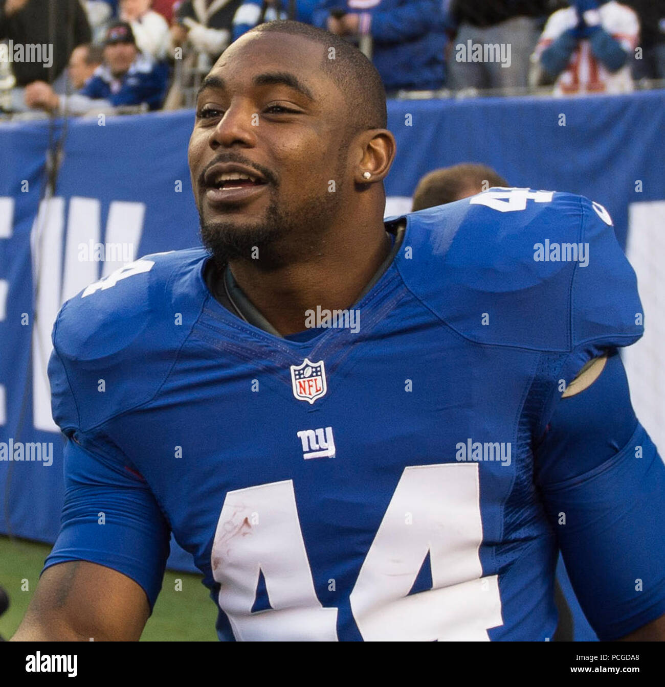 EAST RUTHERFORD, N.J.  (Nov. 4, 2012) Chief of Naval Operations (CNO) Adm. Jonathan Greenert receives a welcome handshake from New York Giants running back Ahmad Bradshaw during a NFL military appreciation game at Metlife Stadium where the Giants hosted the Pittsburgh Steelers. The NFL chose November in conjunction with Veteran's Day to honor the military with their 'Salute to Service' campaign, highlighting servicemembers' contribution to our nation. Stock Photo