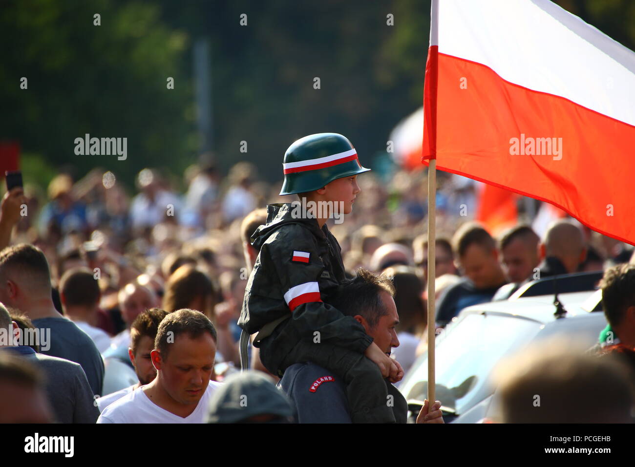 Warsaw, Poland. 01st Aug, 2018. Celebrations on 74th anniversary of Warsaw Uprising in the center of Polish capitol. Masses of participants show flags and flare fires to remember of the city fighters of 1944 during World War II. Credit: Madeleine Lenz/Pacific Press/Alamy Live News Stock Photo