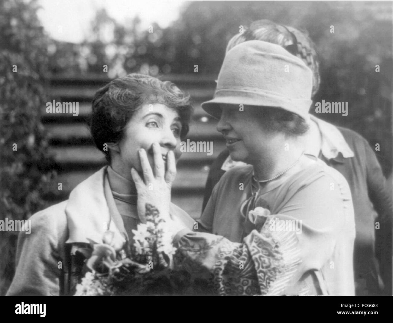 Helen Keller, right, reading the lips of First Lady Mrs. Coolidge by touch January 12, 1926. Helen Keller (June 27, 1880 – June 1, 1968) was an American author, political activist, and lecturer. She was the first deaf-blind person to earn a bachelor of arts degree. Stock Photo