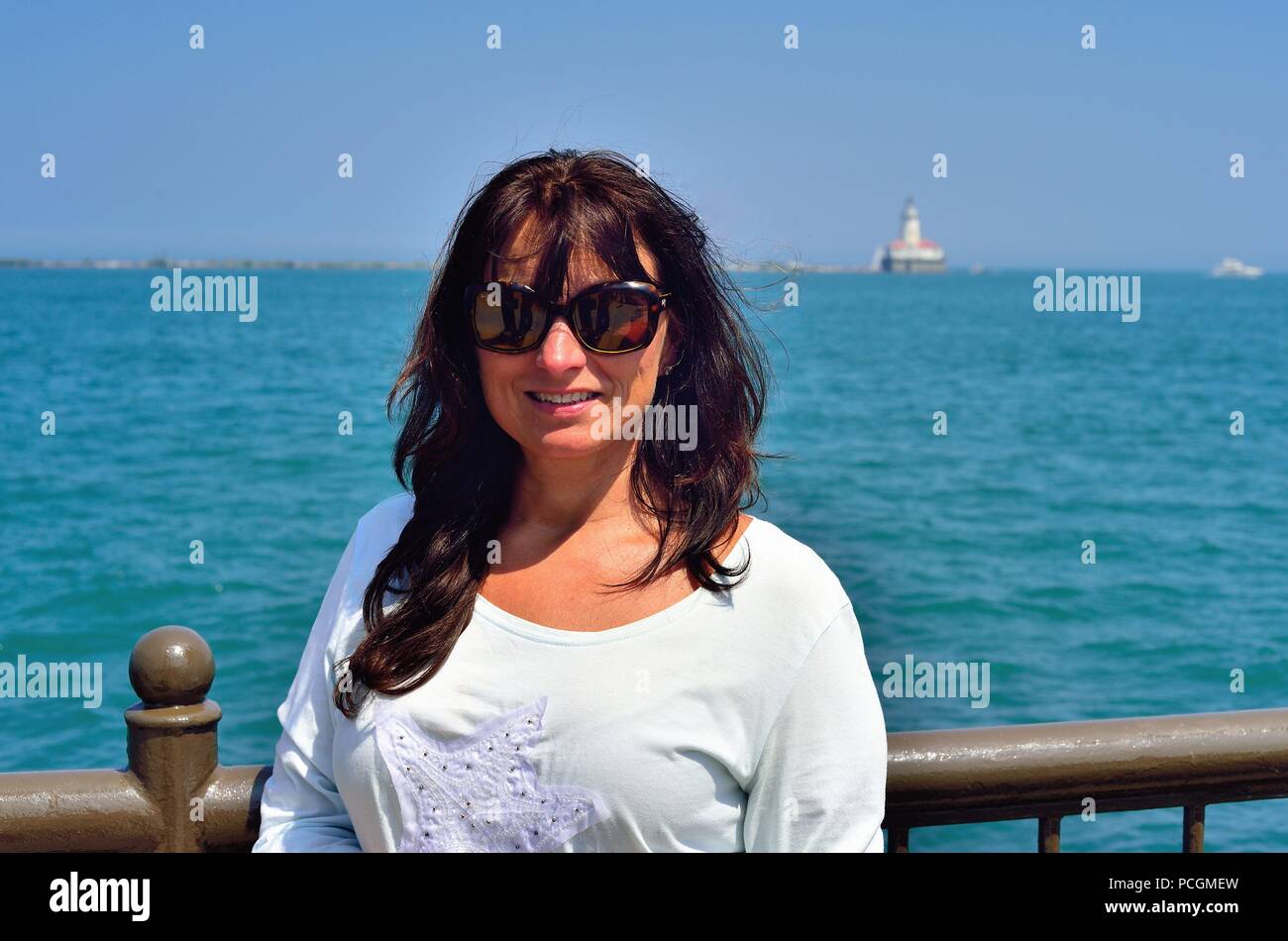 Chicago, Illinois, USA. Woman enjoying a summer visit to Navy Pier. Stock Photo