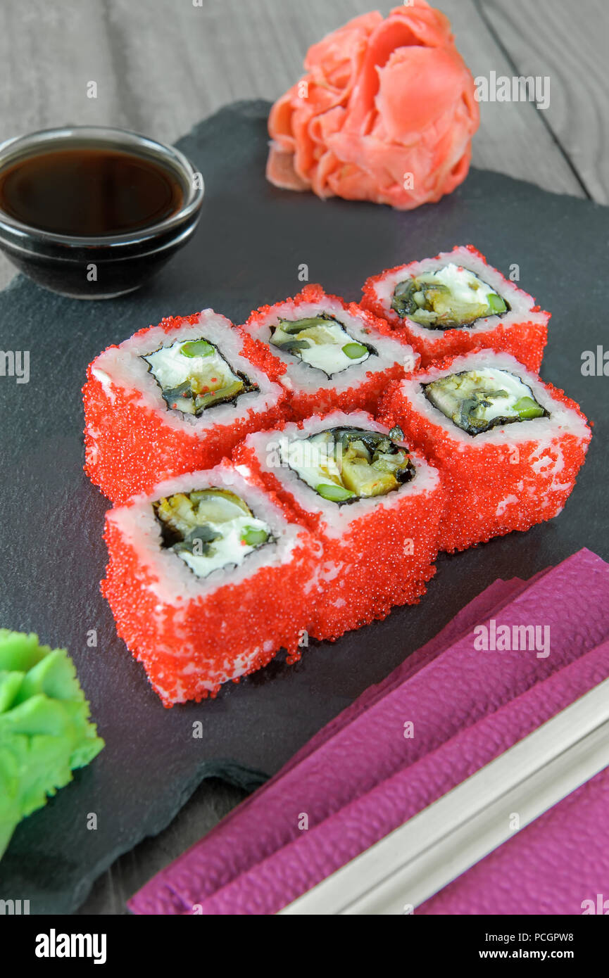 Japanese sushi rice and sea bass, shrimp and smoked eel with caviar of