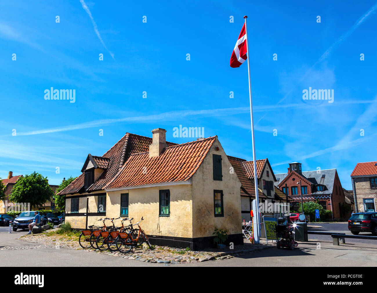 Danish flag flies over waterfront information office at Dragør fishing ...