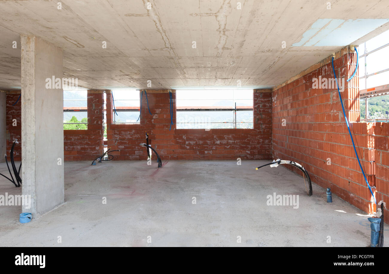Building, construction site in progress to new house, brick walls Stock Photo