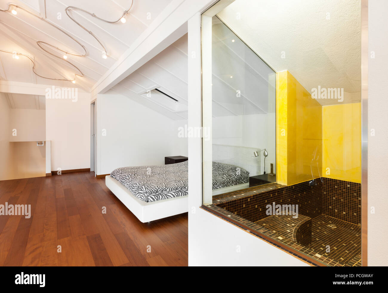 interior loft; nice bedroom with bath; view Stock Photo - Alamy