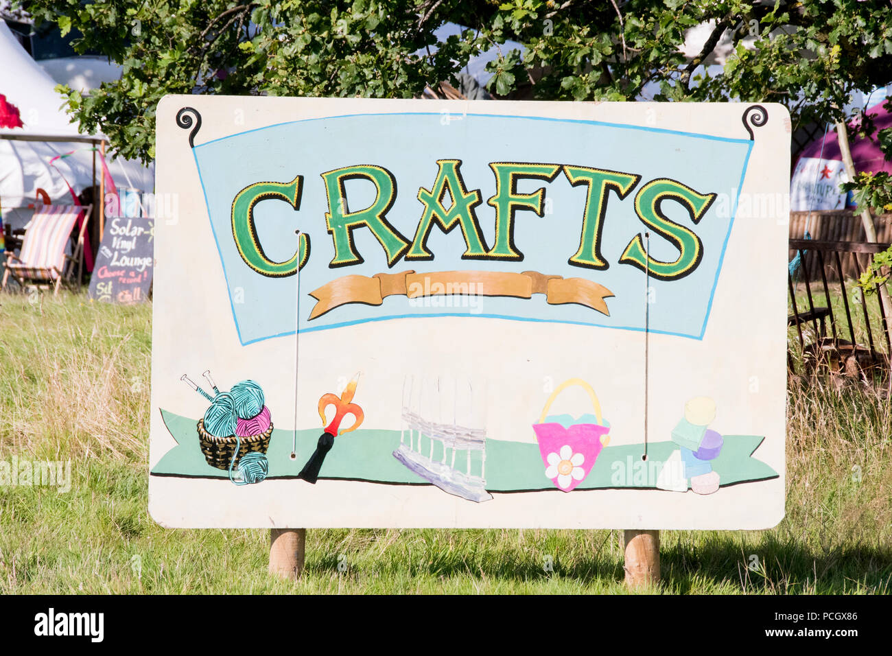 Chepstow, Wales – Aug 14: Colourful festival sign for the Crafts area 14 Aug 2015 at the Green Gathering Festivalline Stock Photo