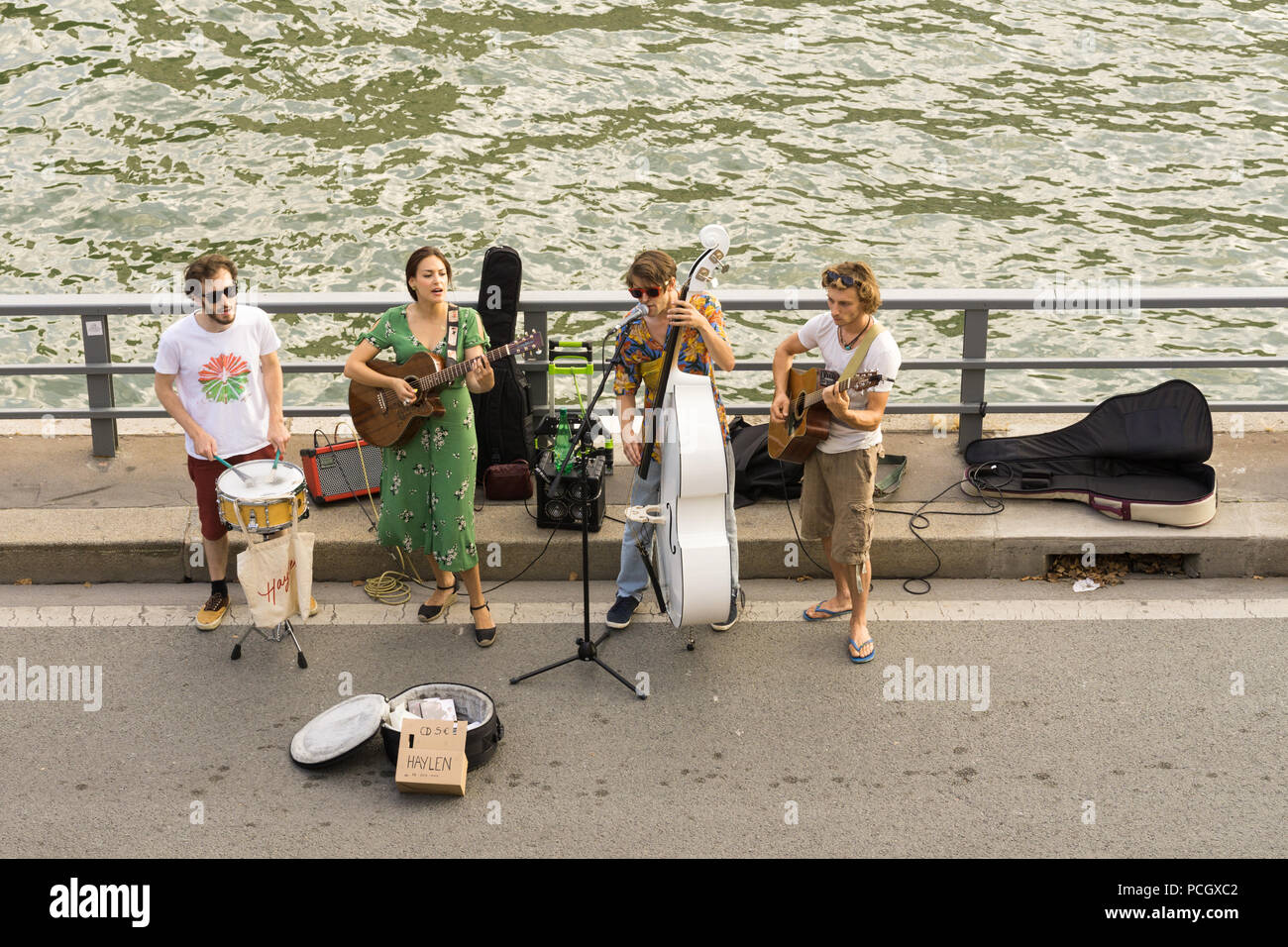 Paris street music band - Street musicians playing at the embankment of the Seine River in Paris, France, Europe. Stock Photo