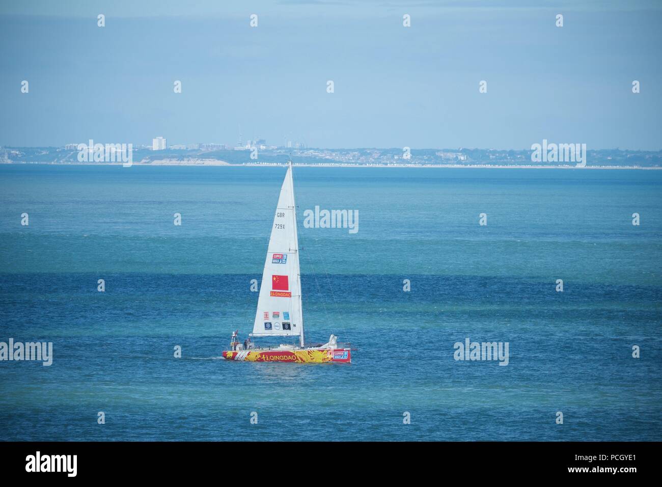 Sanyaz GBR 727X Sailing up the Solent to Cowes for Lendy Cowes Week 2018. Bournemouth can be seen beyond. Stock Photo